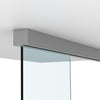 A satin anodized sliding door track mounted to a ceiling above a glass panel.