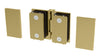 A satin brass Como Series hinge shown with mounting plates and hardware for glass-to-glass installation.