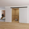 A modern bedroom interior featuring a single sliding glass door installed with the matte black wall mount kit.