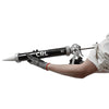 A person wearing work gloves holds the CRL sausage caulk gun to demonstrate its size and use.