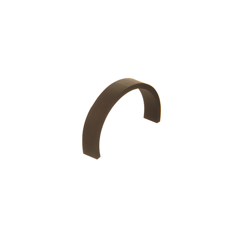 A curved piece of black coil rubber used as an anti-walk block for glass framing.