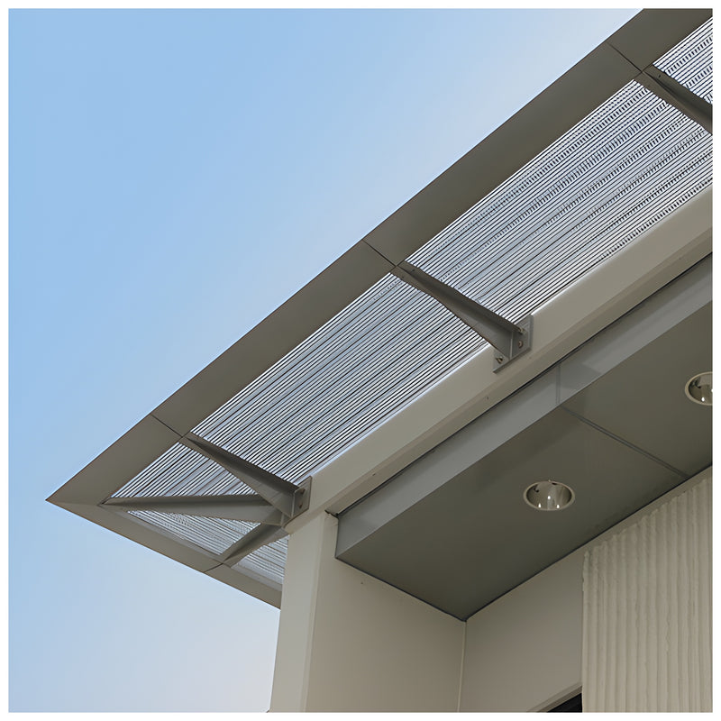 A low-angle view of a CRL Custom 7750 Series sunshade featuring a perforated metal panel mounted to a building exterior.