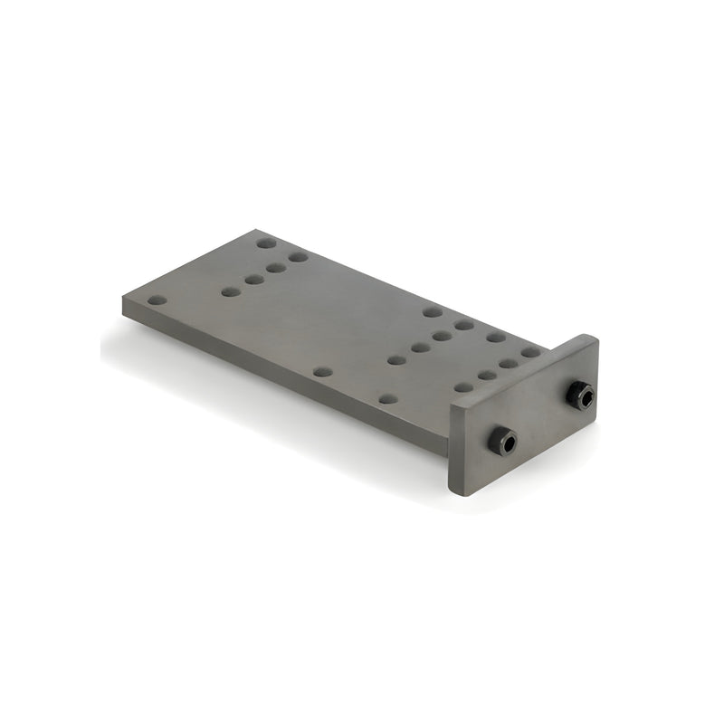 A mill finish metal drill jig with multiple guide holes and an attached end plate for screw race and anchor clip joinery.
