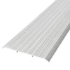 A close-up view of an aluminum saddle threshold featuring a ribbed surface and pre-drilled screw holes.