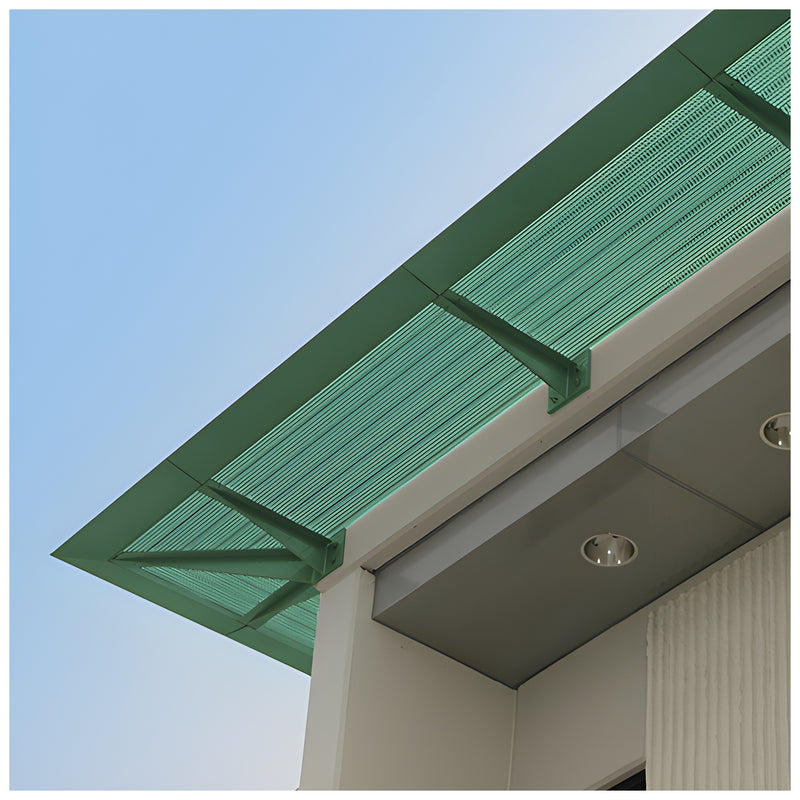 A green perforated metal sunshade is mounted to the exterior wall of a building.
