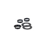 A collection of black circular gaskets and rings used for rigid glass attachment hardware.