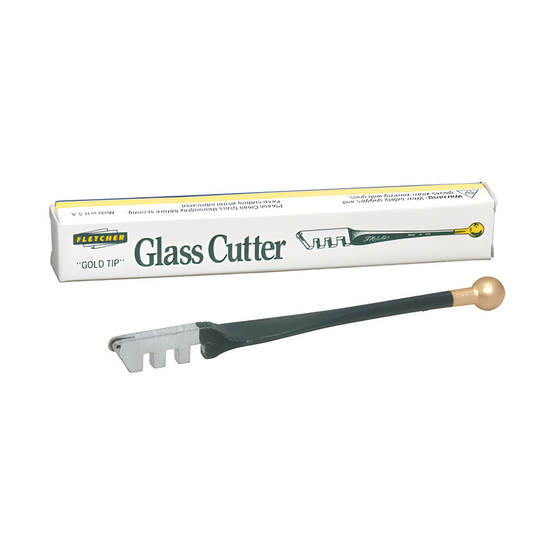 A Fletcher Gold-Tip glass cutter with a metal handle and ball end is displayed in front of its original product packaging box.