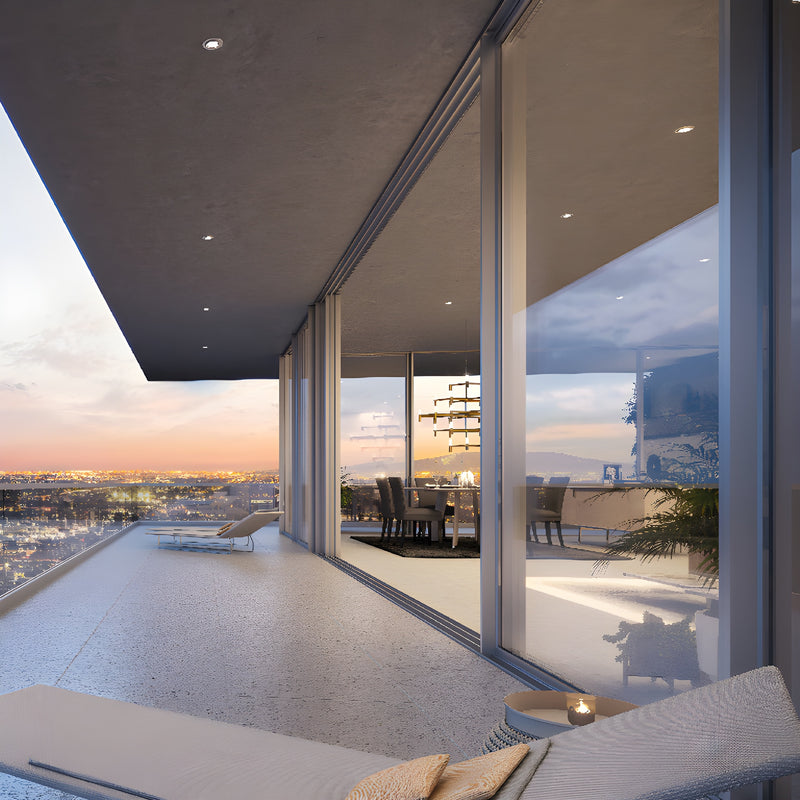 Palisades S100 sliding door (SKU P100S) slim aluminum frame with floor-to-ceiling glass opening to balcony and city sunset