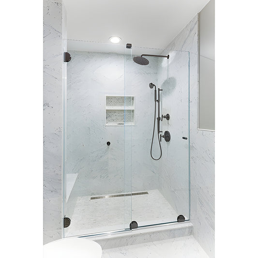 ESS10RB frameless sliding shower door kit with oil-rubbed bronze bottom rollers on clear glass in marble shower.
