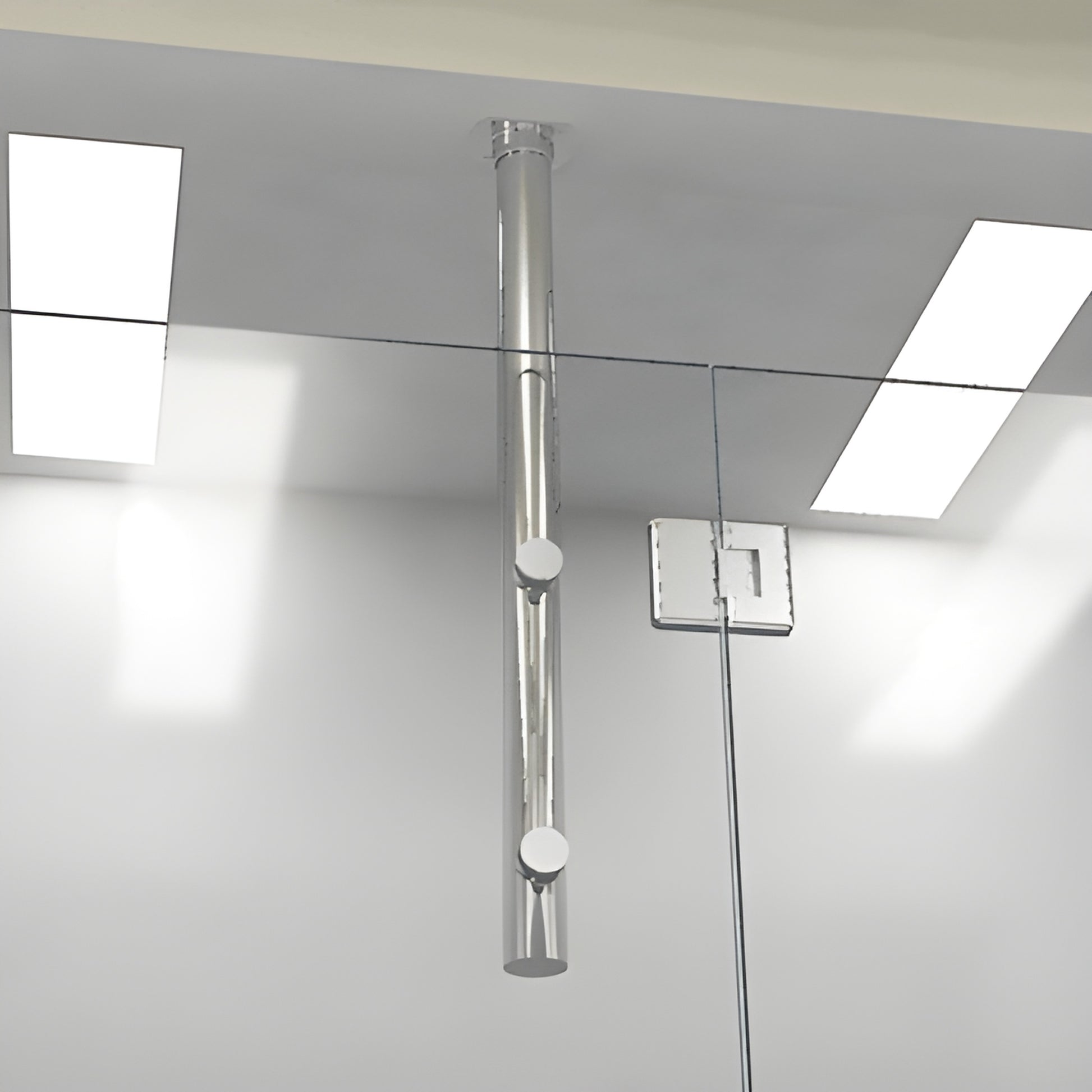 Polished chrome 33 in tubular ceiling-mounted vertical post with two round clamps supporting frameless shower glass (VPK33CH)