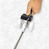 A hand holding the backer rod insert tool while positioning the nylon wheels.