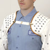 A close-up view shows the white cotton denim protective sleeves secured across the shoulders with a white strap and metal clips.