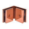 The interior view of the rose gold glass-to-glass clamp showing the mounting screws and gaskets.