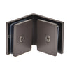 The interior view of the matte gun metal glass-to-glass clamp showing mounting screws and protective gaskets.