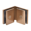 The interior side of a dark brushed bronze 90-degree glass-to-glass clamp showing mounting screws and gaskets.