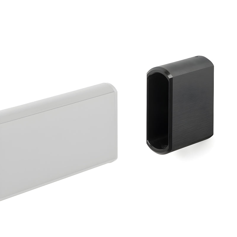 Latitude 34 black stainless end caps, set of 2 - rounded rectangular sleeve for sliding door track terminating at drywall.