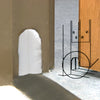 A white dust pad installed on a door jamb to seal the gap near the floor.