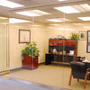 A modern office features glass partitions installed using clear silicone sealant for a seamless look.