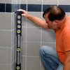 PPL42 expanding plumb level-black rail with vertical spirit vial and three knurled adjustment screws.