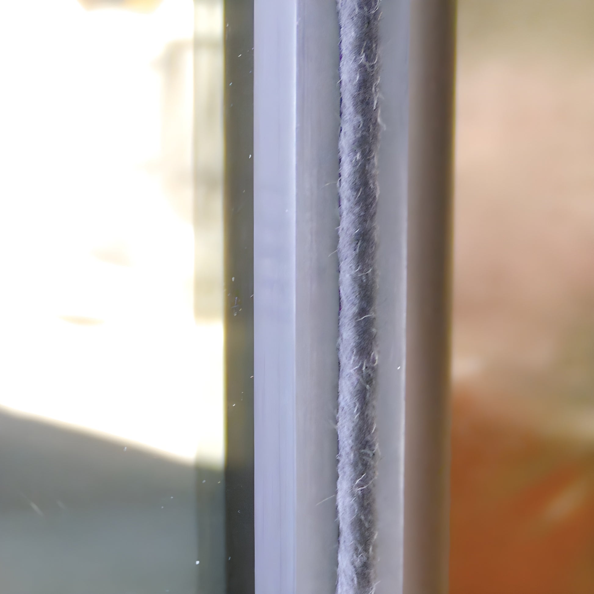 Gray storefront door pile weatherstrip on polypropylene backing strip, 0.350 pile, available 100/300 ft rolls, SKU A11535C