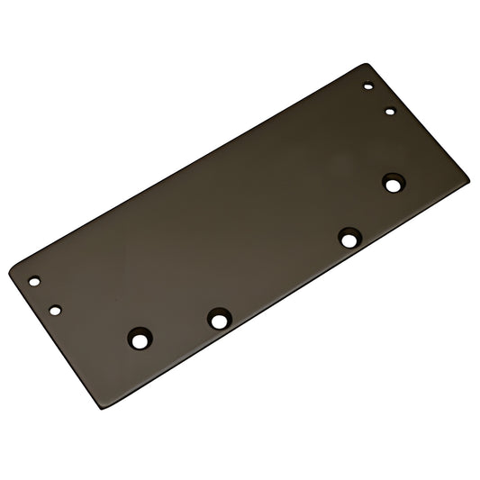 Dark bronze drop plate (SKU DC53DPBRZ) with mounting holes, for DC50-series surface-mounted door closers.