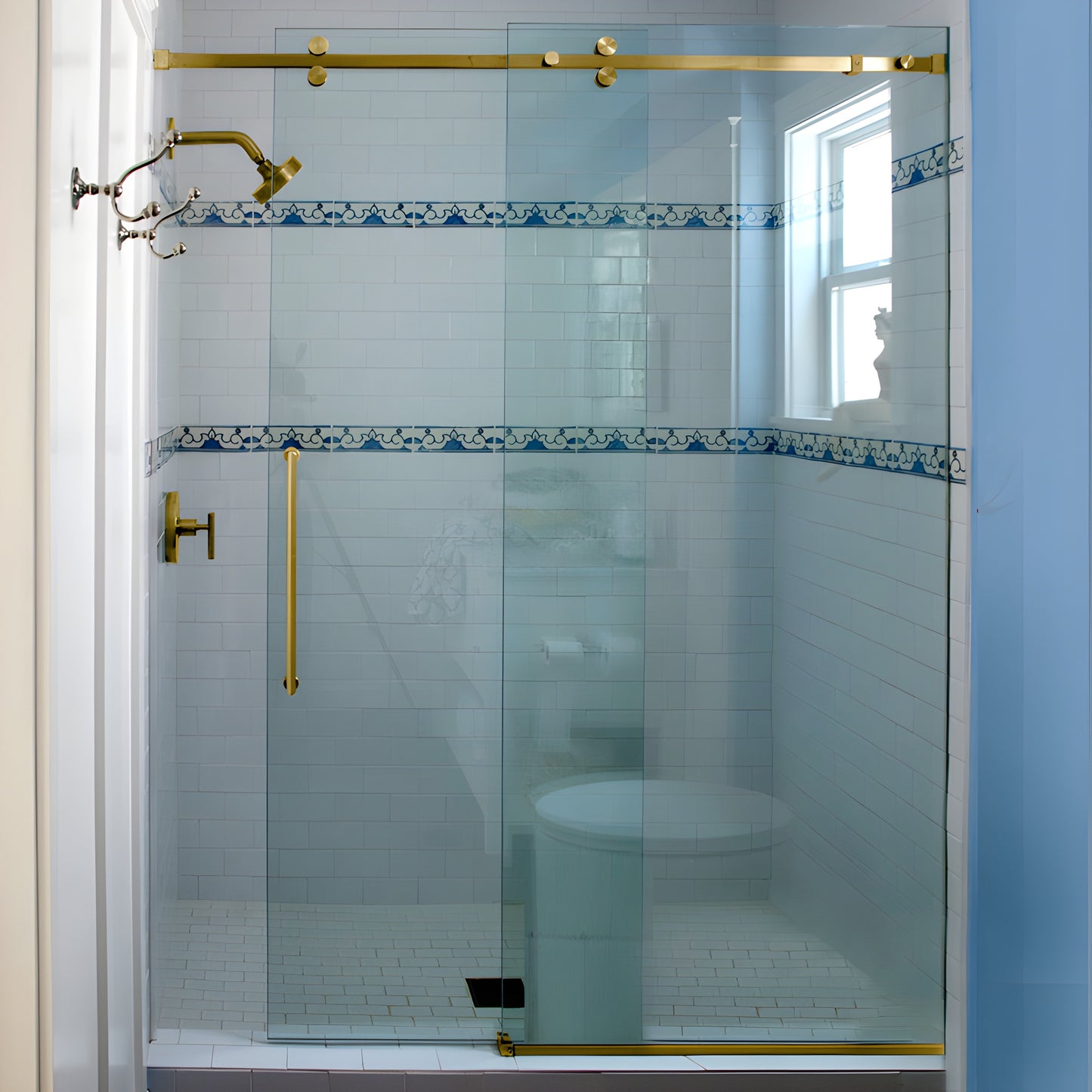 SER78SB satin brass frameless sliding shower system with squared header and rollers over clear glass, 78-3/4 in.