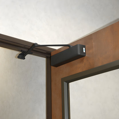 PR90DU dark bronze surface-mounted cast iron door closer with parallel arm, mounting hardware and adjustable spring power.