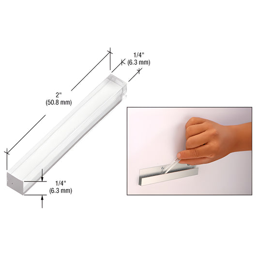 PSB250 clear 2" x 1/4" plastic setting block for frameless glass or mirror, shown with placement in a J channel/h-bar track.