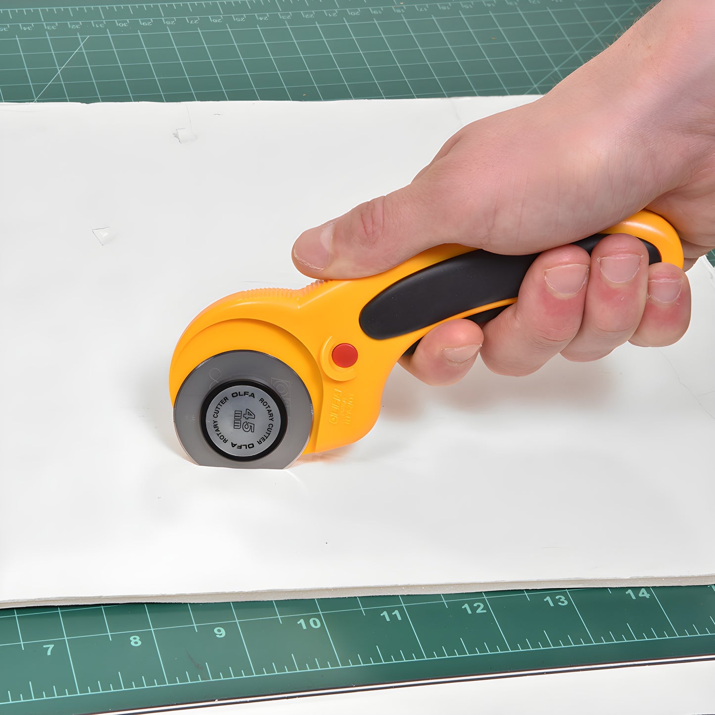 Olfa RT45 45mm ergonomic rotary cutter, orange/black handle, anti-slip grip, self-retracting blade