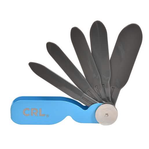 "Compact plastic foldable spatula with holder - perfect for small kitchens and easy storag