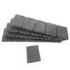 Stack of black multipolymer bearing shim strips (CRL PBS04), 4 2 in, 1/4 in thick, snap-off tabs