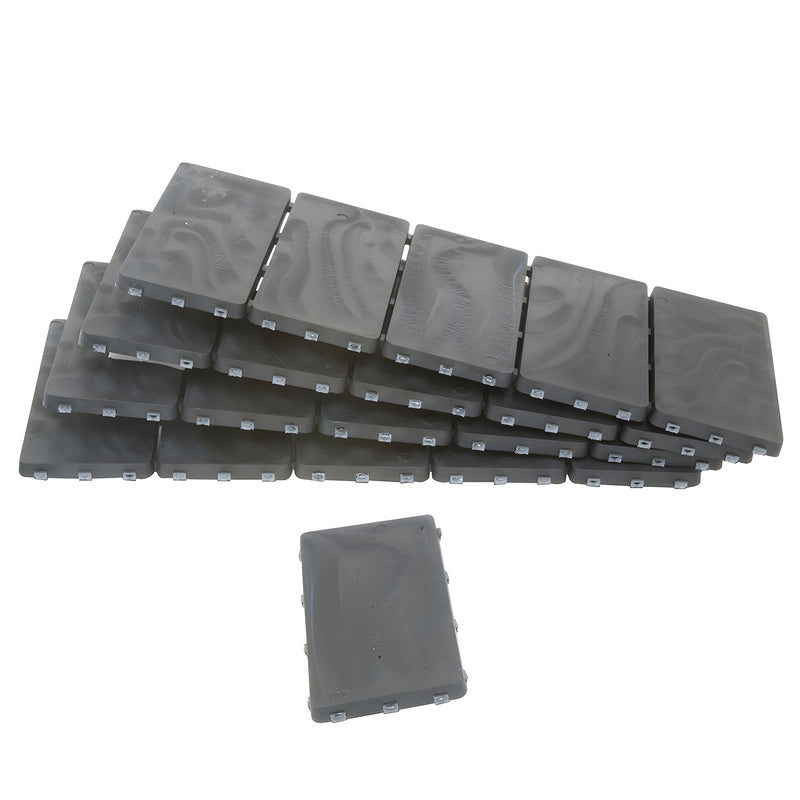 Stack of black multipolymer bearing shim strips (CRL PBS04), 4 2 in, 1/4 in thick, snap-off tabs