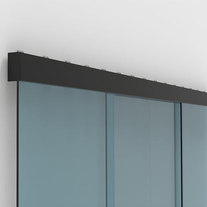Matte black wall-mounted top track with two synchronized sliding tempered glass panels.