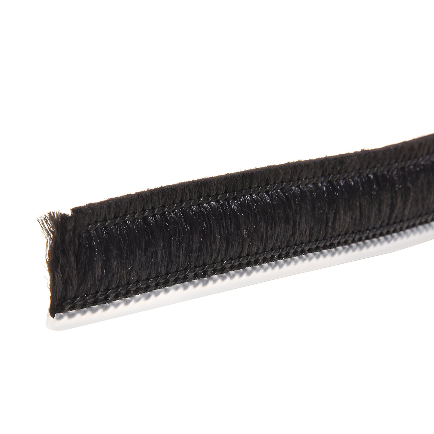W510B black polypropylene astragal pile weatherstrip strip on white backing, close-up of dense brush pile.